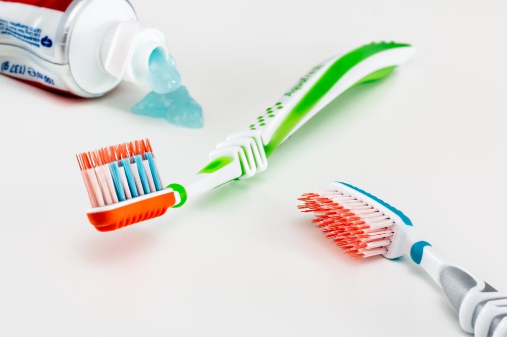 Colorful toothbrushes and toothpaste