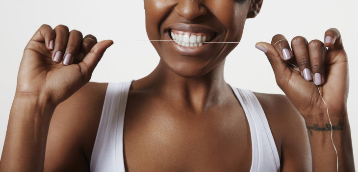 woman with a dental floss