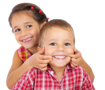 Two funny smiling little children