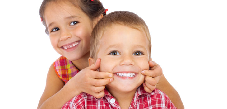 Two funny smiling little children